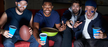 Fans watching football